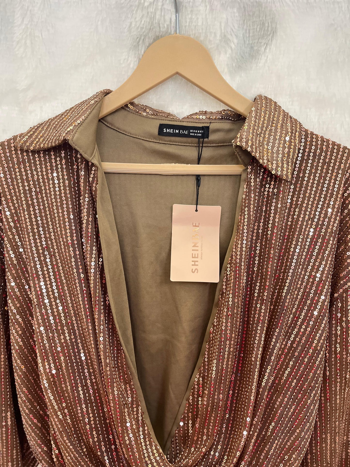 22. Open V-Neck Sequin Top